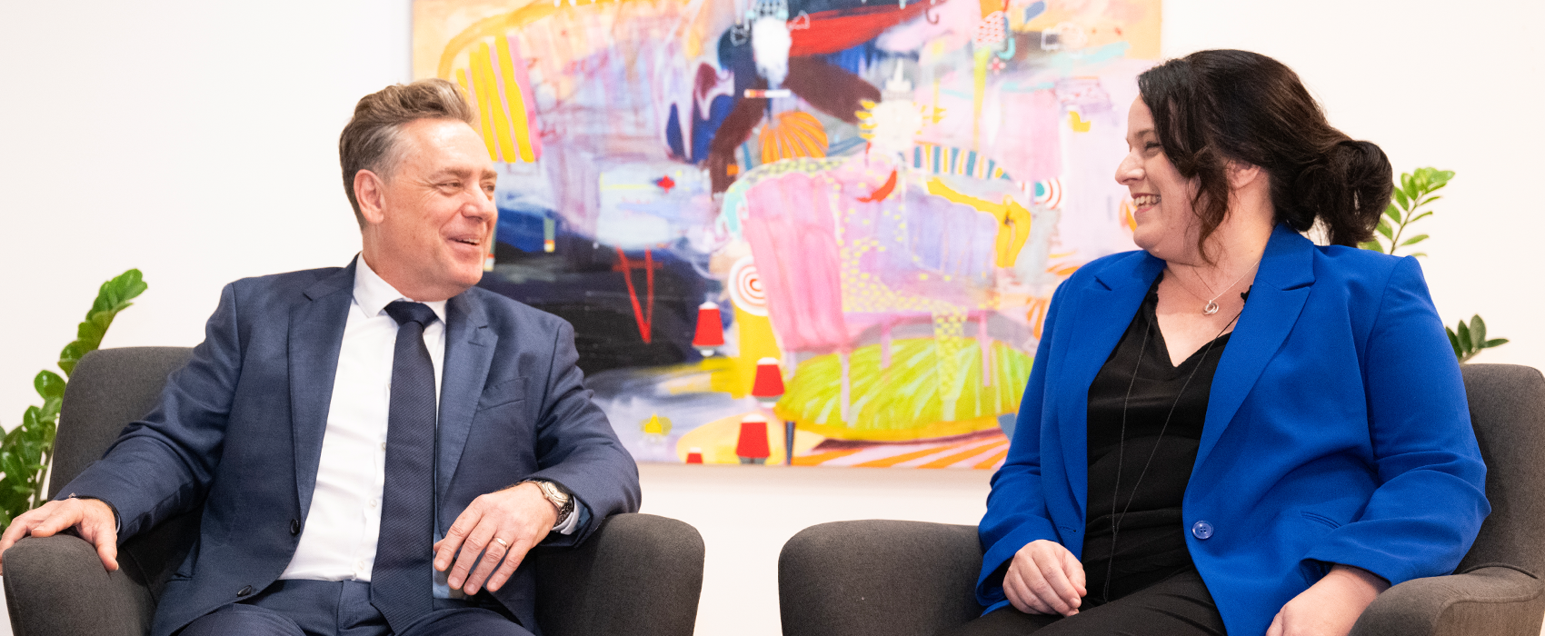 Fiona Armstrong, CEO, and Michael Burke, Executive Chair, sit side-by-side having a discussion